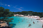 People swimming in the sea at Cala Turqueta, Minorca, Spain