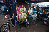 Rickshaw, monsoon, inundation, Varanasi, Benares, Uttar Pradesh, India