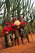 Antandroy children with giant bird's egg, South Madagascar