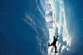 Ice climber on steep climb, Briksdal Glacier, Norway