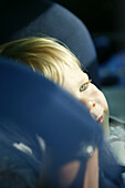 Little boy in child car seat