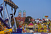 Fairground rides of the Oktoberfest in front of the Church of our Lady, Munich, Upper Bavaria, Bavaria, Germany, Europe