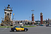 Torres Venicianes, venetian towers and cars at Plaza de Espanya, Barcelona, Spain, Europe