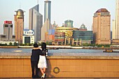 Pudong skyline and people at the river bank, Shanghai, China, Asia