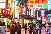 People at an illuminated shopping street in the evening, Shanghai, China, Asia