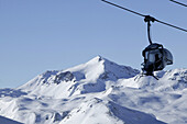 Skier in chair lift, Livigno, Italy