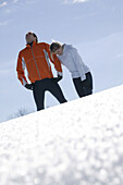 Young couple of joggers resting