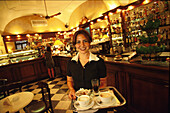 Waitress carrying a tray with cappuccinos, Francesca, Antico Café, Piazza Constituzione, Cagliari, Sardinia, Italy
