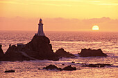 Corbiére lifghthouse at sunrise, Jersey, Channel Islands, Great Britain