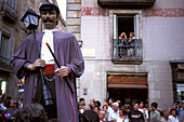 Figure of a saint and people on the street, Merce Celebration, Barcelona, Spain, Europe