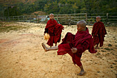 young monks, playing chinlon football, hill monastery, Burma, Myanmar