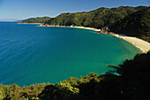 Mutton Cove, beach in a bay in the sunlight, Abel Tasman Coast Track, Abel Tasman National Park, New Zealand, Oceania