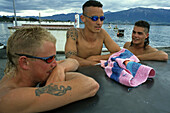 Cool young men, tattoos, sunglasses, NZ, young men with tattoos, at jetty for a swim, Kaikoura, South Island, Jungs, Taetowierung, Sonnenbrille