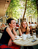 Two young women on cafe's terrace, Cafe Coffeemania, Bolschaja Nikitskaja Street, Mowcow, Russia