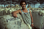 Wool bales in storehouse, Napier, Portrait of Maori worker in wool warehouse, Arbeiter in Wollager, Hawkes Bay