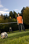 Young men playing soccer, awaiting free kick