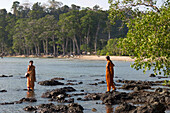 Two Indian women bathing in the water, Chiriya Tapu beach, South Andaman, Andaman Islands, India