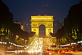 Triumphal arch and Champs Elysees at night, Paris, France, Europe