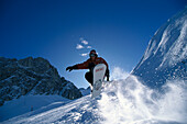 Snowboarder in action, Performing a jump, Austria