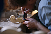 Man carving a fiddle, Mittenwald, Bavaria, Germany