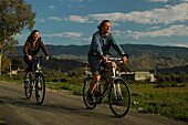 A couple on a bike tour in the countryside, Andalusia, Spain