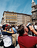 Tourists with Video camera, Marienplatz, Munich Bavaria, Germany