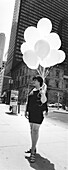 Lady with balloons, Midtown, Manhattan, New York, USA