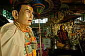 Mount Popa, home of the Nats, Mount Popa gilt als Wohnstaette der 37 Nats, Geister die als Schutz fuer irdische Wohl Mount Popa, is where the 37 Nats originated, spirits responsible for earthly things, Nat figures at the foot of Mount Popa