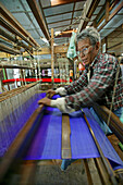 Weaver on loom, craftsman, Weberei, Handarbeit, Mann arbeitet am Webstuhl, Weber