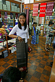 Fabric shop at weavers, Laden fuer handgewebte Stoffe in der Weberei, Mandalay
