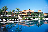 Hotel and pool under blue sky, Furama Resort, Danang, Vietnam, Asia