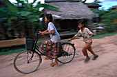 Children with bycicle, Cambodia Asia
