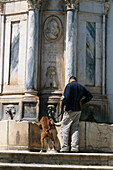 Dog drinking from a fountain, Moura, Alentejo Portugal