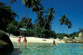 Family swimming in the ocean, Island Perhentian, East Coast, Malaysia, Asia