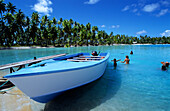 Boat, Children, Lagoon, Takapotu, Tuamotu Islands French Polynesia, South Pacific