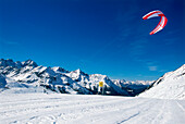 Man kiteboarding in snow, Lermoos, Lechtaler Alpen, Tyrol, Austria