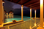 The illuminated pool of the Chedi Hotel at night, Muscat, Oman
