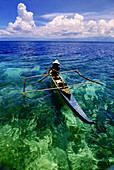 Outrigger over coral reef, Visaya Islands, Philippines