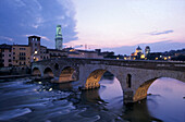 View at the bridge Ponte Pietra at dusk, Verona, Italy