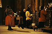 Indios and whites praying in Cuenca cathedral, Cuenca, Ecuador South America