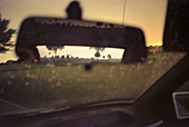 View out of the windscreen of a car at sunset, North Rhine-Westphalia, Germany
