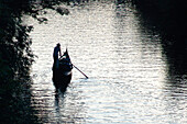 Lonely gondolier rowing on Elster river, Leipzig, Saxony, Germany