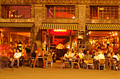 People sitting outside a bar at night, Leipzig, Saxony, Germany