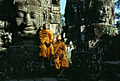 Monks and buddhas, Bayon temple, Angkor, Siem Raep Cambodia