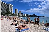 Sunbathing on Waikiki Beach, Honolulu, Oahu, Hawaii, USA