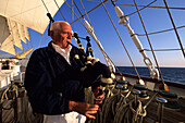 Royal Clipper Captain, Klaus Mueller Playing Bagpipes, Sailing in Mediterranean Sea, Italy