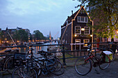 Bicycles, de Sluyswacht, Oude Schans, Bicycles in front of de Sluyswacht, a brown cafe, in the evening, Oude Schans, Amsterdam, Holland, Netherlands