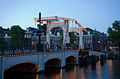 Magere Brug, Amstel, Illuminated Magere Brug Skinny Bridge, in the evening, Amsterdam, Holland, Netherlands