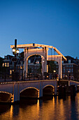 Magere Brug, Amstel, Illuminated Magere Brug Skinny Bridge, in the evening, Amstel, Amsterdam, Holland, Netherlands