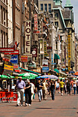 Souvenir Shops, Damrak, People walking over shopping street with a lot of souvenir shops, Damrak, Amsterdam, Holland, Netherlands